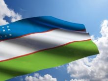 stock footage uzbekistan flag animation with real time lapse clouds